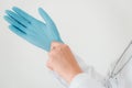 Close-Up of Female Doctor is Wearing Glove With a Stethoscope on White Isolated Background. Surgeon Occupation, Healthcare and Royalty Free Stock Photo