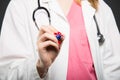 Close-up of female doctor writing on invisible board Royalty Free Stock Photo