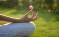 A woman meditating outdoor. Yoga lotus pose