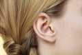 Close up on female ear and braid hair