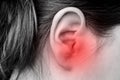 Close up of female ear with source of pain. Earache. Royalty Free Stock Photo