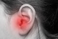 Close up of female ear with source of pain. Earache. Royalty Free Stock Photo
