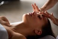 Head and face massage in spa salon