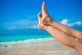 Close up of female feet on white sandy beach Royalty Free Stock Photo