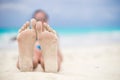 Close up of female feet on white sandy beach Royalty Free Stock Photo