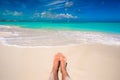 Close up of female feet on white sandy beach Royalty Free Stock Photo