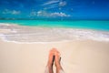 Close up of female feet on white sandy beach Royalty Free Stock Photo