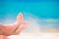 Close up of female feet on white sandy beach Royalty Free Stock Photo