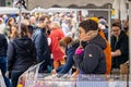 Close up of female food stall vendor at Frome Sunday Market, Somerset, UK