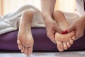Close-up of hands of masseur doing massage of female feet Royalty Free Stock Photo