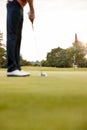 Close Up Of Female Golfer Putting Ball On Green Royalty Free Stock Photo