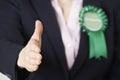Close Up Of Female Green Party Politician Reaching Out To Shake