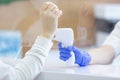 Close up of a female hand being measured body temperature with a contactless thermometer by the employee of the