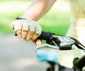 Close up female hand on bicycle handlebar Royalty Free Stock Photo