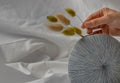 Close-up of Female hand with a gentle holding a bouquet of Dried flowers on Handmade Ceramic Vase Royalty Free Stock Photo