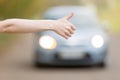 Close up of female hand hitchhiking Royalty Free Stock Photo