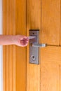 Close up of female hand hold key card and open electronic lock door Royalty Free Stock Photo