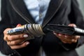 close-up of a female hand holding a black wallet in which there are dollars. Royalty Free Stock Photo