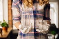 Close up of female hand holding bottle and glass with pure water Royalty Free Stock Photo