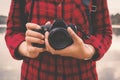 Close-up of female hand holding camera and enjoying in nature Royalty Free Stock Photo