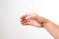 Close up of female hand holding something like a bottle or glass isolated on white background Royalty Free Stock Photo