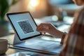 Office worker scanning qr code displayed on digital tablet screen Royalty Free Stock Photo
