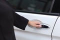 Close up female hand opening car or automobile door Royalty Free Stock Photo