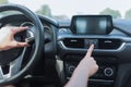 Close-up, female hand presses emergency stop button, alarm accident on road, danger and a warning of motorists on