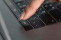 Close-up female hand pressing esc button on laptop keyboard Royalty Free Stock Photo