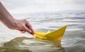 Female hand holding paper boat Royalty Free Stock Photo