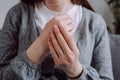 Close-up of female hand with symptoms of chronic gout. Health care easy self-massage concept. Pain in fingers. Sick young woman