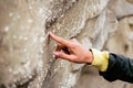 Close up female hand touch prehistorical artifacts-shell fossils in stone in Pantishara - Datvis khevi valley in Vashlovani Royalty Free Stock Photo