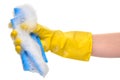 Close up of female hand in yellow protective rubber glove holding blue rag in foam Royalty Free Stock Photo