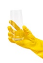 Close up of female hand in yellow protective rubber glove holding clean transparent drinking glass Royalty Free Stock Photo