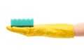 Close up of female hand in yellow protective rubber glove holding green cleaning sponge Royalty Free Stock Photo