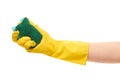 Close up of female hand in yellow protective rubber glove holding green cleaning sponge Royalty Free Stock Photo