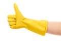 Close up of female hand in yellow protective rubber glove showing thumbs up sign Royalty Free Stock Photo