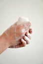 Close up of woman washing her hands with a bar of soap and soapy suds Royalty Free Stock Photo