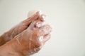 Close up of woman washing her hands with a bar of soap and soapy suds Royalty Free Stock Photo