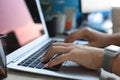 Close up of female hands busy typing on laptop in modern office Royalty Free Stock Photo