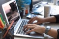 Close up of female hands busy typing on laptop in modern office Royalty Free Stock Photo