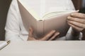 Close up of female hands holding open book.  Woman reading a book. Royalty Free Stock Photo