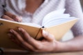 Close up female hands holding pen and book Royalty Free Stock Photo