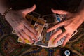 Close up female hands holding tarot cards. Fortuneteller. Witchcraft. Royalty Free Stock Photo