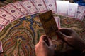 Close up female hands holding tarot cards. Fortuneteller. Witchcraft. Royalty Free Stock Photo