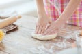 Close up of female hands kneading dough at home Royalty Free Stock Photo