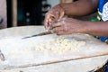 Close-up of female hands kneading flour