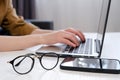 Close up of female hands on laptop keyboard, woman working in office. Caucasian female using computer at home. Business, freelance Royalty Free Stock Photo