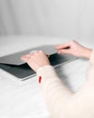 Close up of female hands on a laptop opening the device to get started