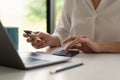 Close up of female hands making online payment for online shopping at home Royalty Free Stock Photo